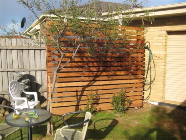 How can you hide a water tank on your property