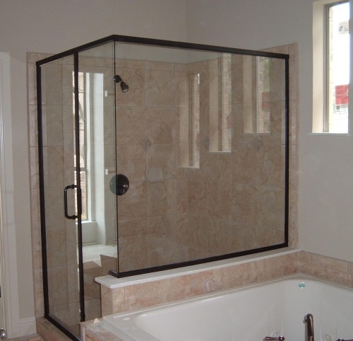 Semi-frameless shower enclosures