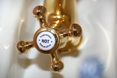 Close Up Photography of Brass Hot Faucet